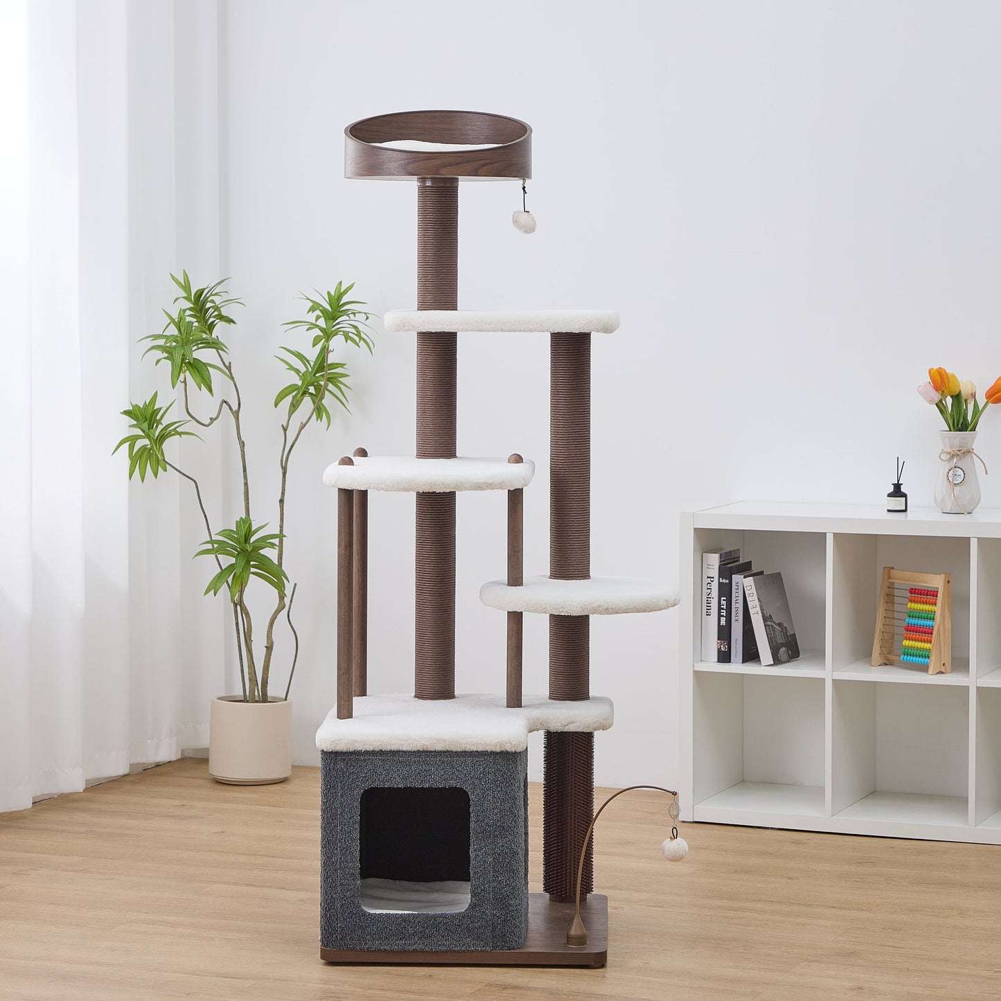Catry Trinity CT240359 cat tree with six levels, five scratching posts, four resting platforms, two toys, one bed, and one cat condo in a room with a white bookshelf and plants
